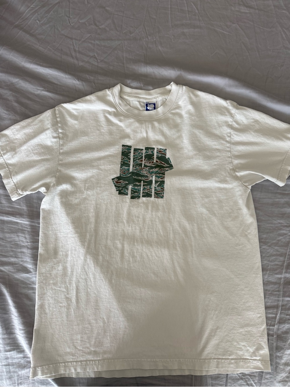 Undefeated White Tee with Green Camo Logo Made in USA